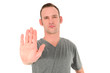 Young man making a Stop gesture
