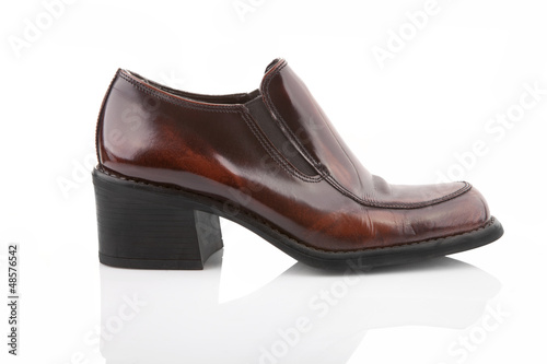 Photo: Brown shiny women shoe isolated on white Brown shiny women shoe isolated on white