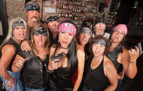 Photo: Biker Woman with Pistol Biker Woman with Pistol