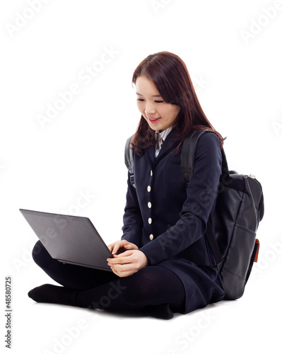 Photo: Yong pretty Asian student studying whit laptop Yong pretty Asian student studying whit laptop