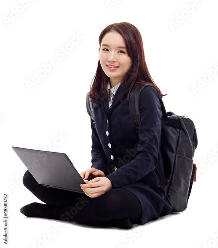 Photo: Yong pretty Asian student studying whit laptop Yong pretty Asian student studying whit laptop