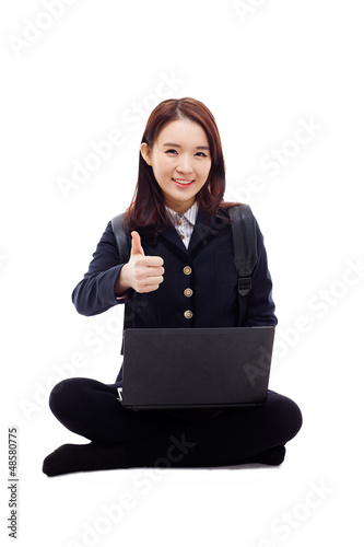 Photo: Yong pretty Asian student studying whit laptop Yong pretty Asian student studying whit laptop