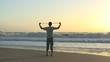 Man doing exercises on a beach