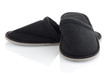 A pair of grey slippers