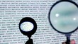 Round loupe moves over text projection on wall