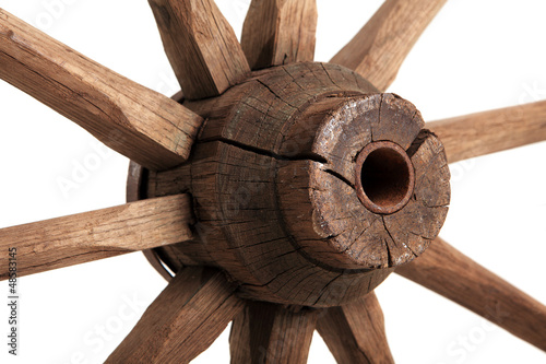 Photo: Old wooden wheel on the white background Old wooden wheel on the white background