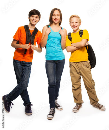 Photo: Happy teen kids with backpacks Happy teen kids with backpacks
