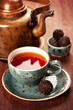 Photo: Tea and chocolate candies in a vintage style Tea and chocolate candies in a vintage style