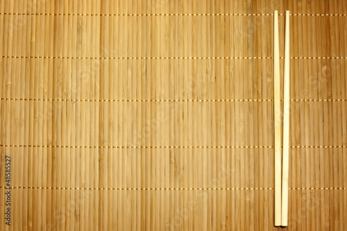 Photo: Bamboo mat and chopsticks food background Bamboo mat and chopsticks food background