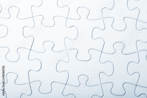 Photo: Jigsaw puzzle with blank white pieces Jigsaw puzzle with blank white pieces