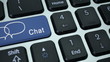 Chat. Close-up on chatting speech bubbles icon on a key