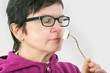 Photo: Woman smelling cheese Woman smelling cheese