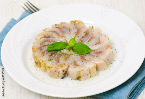 Photo: pieces of salt herring fish pieces of salt herring fish