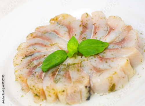 Photo: pieces of salt herring fish pieces of salt herring fish