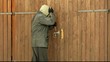 Robber trying to break the garage door