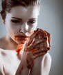 Closeup portrait of horror beautiful vampire woman with blood
