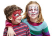 Photo: Young boy and girl with face painting of cat and spiderman Young boy and girl with face painting of cat and spiderman