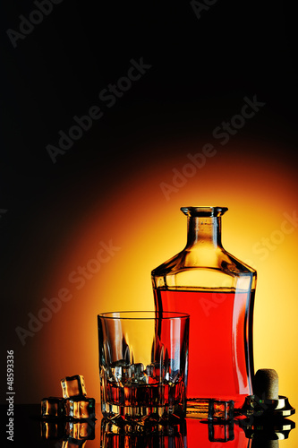 Photo: Bottle of whisky and glass Bottle of whisky and glass