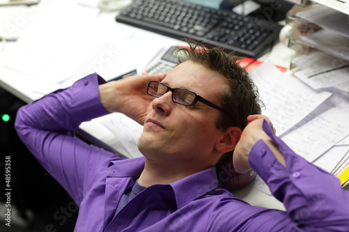 Photo: young business professional man,relaxing neck and relieving pain young business professional man,relaxing neck and relieving pain