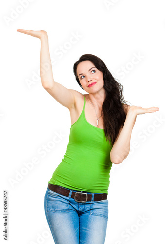 Photo: Beautiful woman showingor comparing with hands Beautiful woman showingor comparing with hands