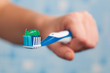 hand holding toothbrush