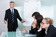 Photo: Bored businesswoman sleeping in a meeting Bored businesswoman sleeping in a meeting