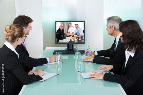 Photo: Businesspeople watching an online presentation Businesspeople watching an online presentation