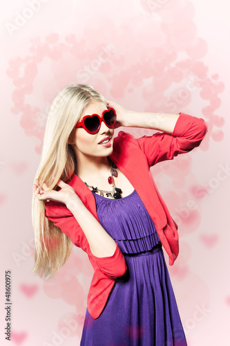 Photo: valentine's day young girl with heart shaped glasses valentine's day young girl with heart shaped glasses