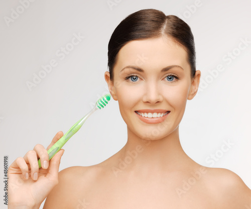 Photo: woman with toothbrush woman with toothbrush