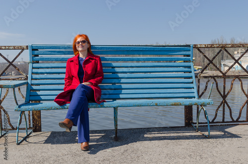 Photo: Red woman enjoying sunny day Red woman enjoying sunny day