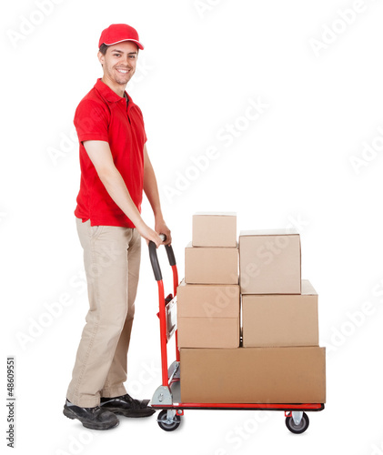 Photo: Deliveryman with a trolley of boxes Deliveryman with a trolley of boxes