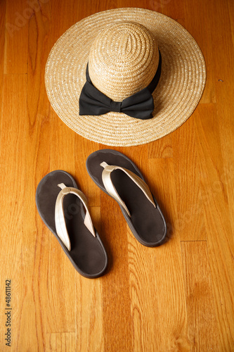Photo: Beach Sandals and Straw Hat on Deck Beach Sandals and Straw Hat on Deck