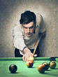 man playing pool
