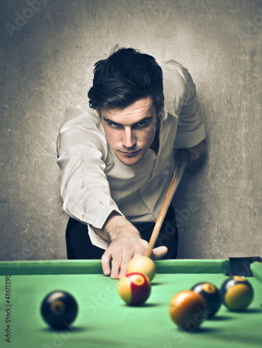 Photo: man playing pool man playing pool