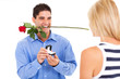 young man with rose and ring proposing to his girlfriend