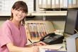 Nurse Working At Nurses Station