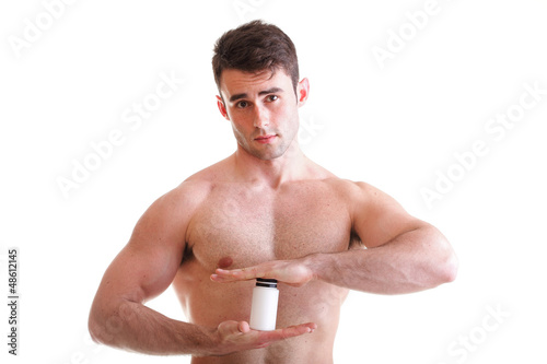 Photo: sexy male body builder holding a boxes with supplements on his b sexy male body builder holding a boxes with supplements on his b