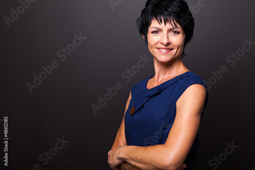 Photo: cute middle aged woman portrait on black cute middle aged woman portrait on black