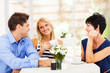 happy young man meeting mother in law with his wife