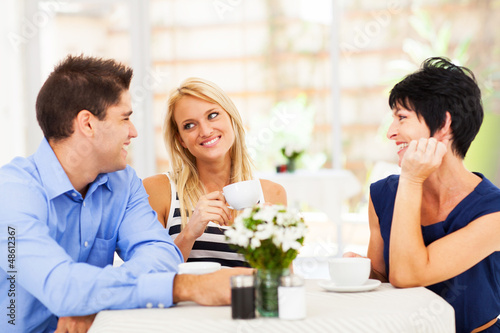 Photo: happy young man meeting mother in law with his wife happy young man meeting mother in law with his wife