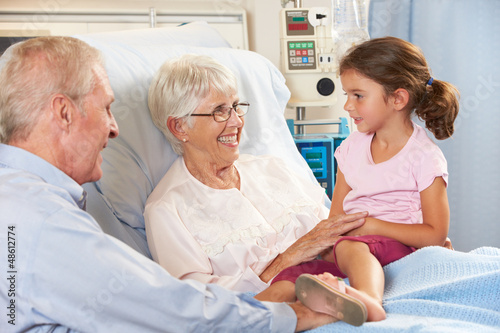 Photo: Granddaughter Visiting Grandmother In Hospital Bed Granddaughter Visiting Grandmother In Hospital Bed