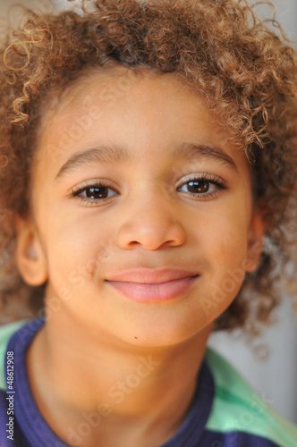 Photo: Young mixed race boy with curly hair Young mixed race boy with curly hair