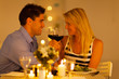 Photo: loving young couple enjoying a glass of wine in restaurant loving young couple enjoying a glass of wine in restaurant