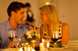Photo: loving couple having romantic dinner in a restaurant loving couple having romantic dinner in a restaurant