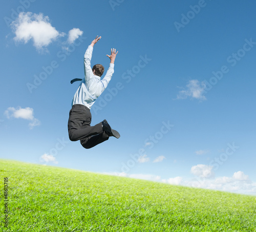 Photo: man jumping on meadow man jumping on meadow