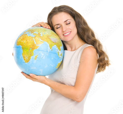 Photo: Happy young woman hugging globe Happy young woman hugging globe