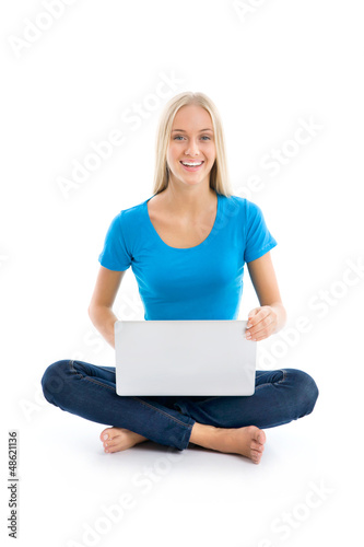 Photo: Portrait of a happy young girl with laptop computer Portrait of a happy young girl with laptop computer