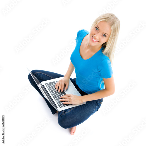 Photo: Portrait of a happy young girl with laptop computer Portrait of a happy young girl with laptop computer