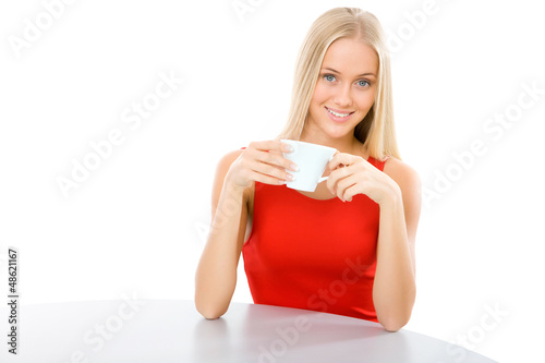 Photo: Young beautiful woman with a cup tea Young beautiful woman with a cup tea
