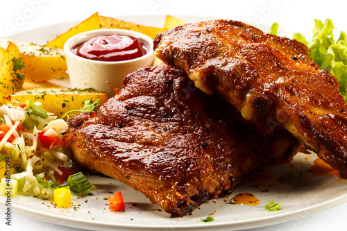 Photo: Tasty grilled ribs with vegetables Tasty grilled ribs with vegetables